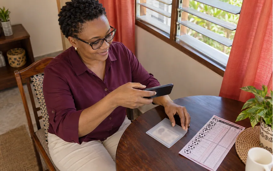 Wasafi Bet verification preparation illustrated by an adult with a private ID sleeve, phone and sports coupon